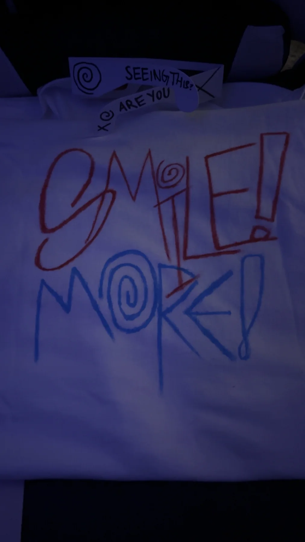 White cropped shirt with hand-drawn Smile More lettering